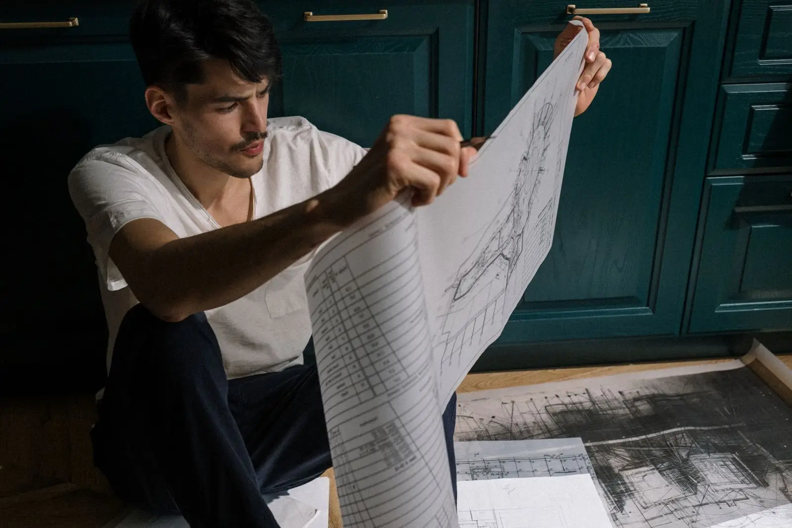 Builder reviewing project documentation before site work begins