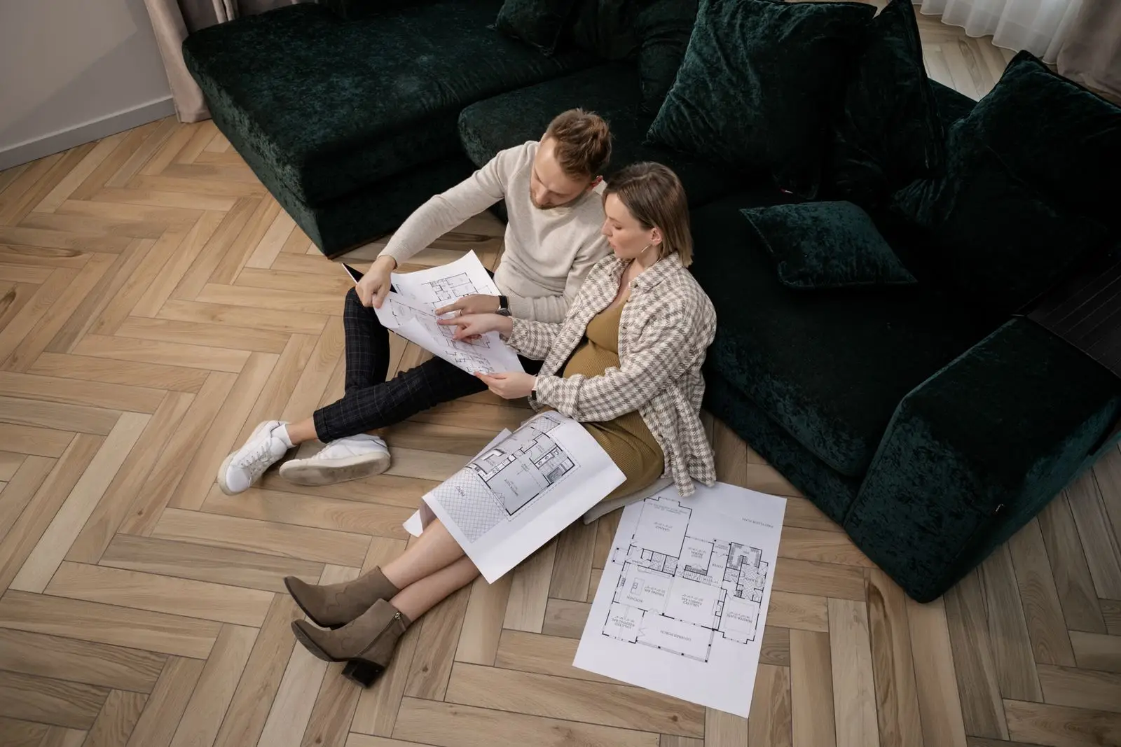 custom home builders Melbourne: Clients reviewing home plans together before approving the design
