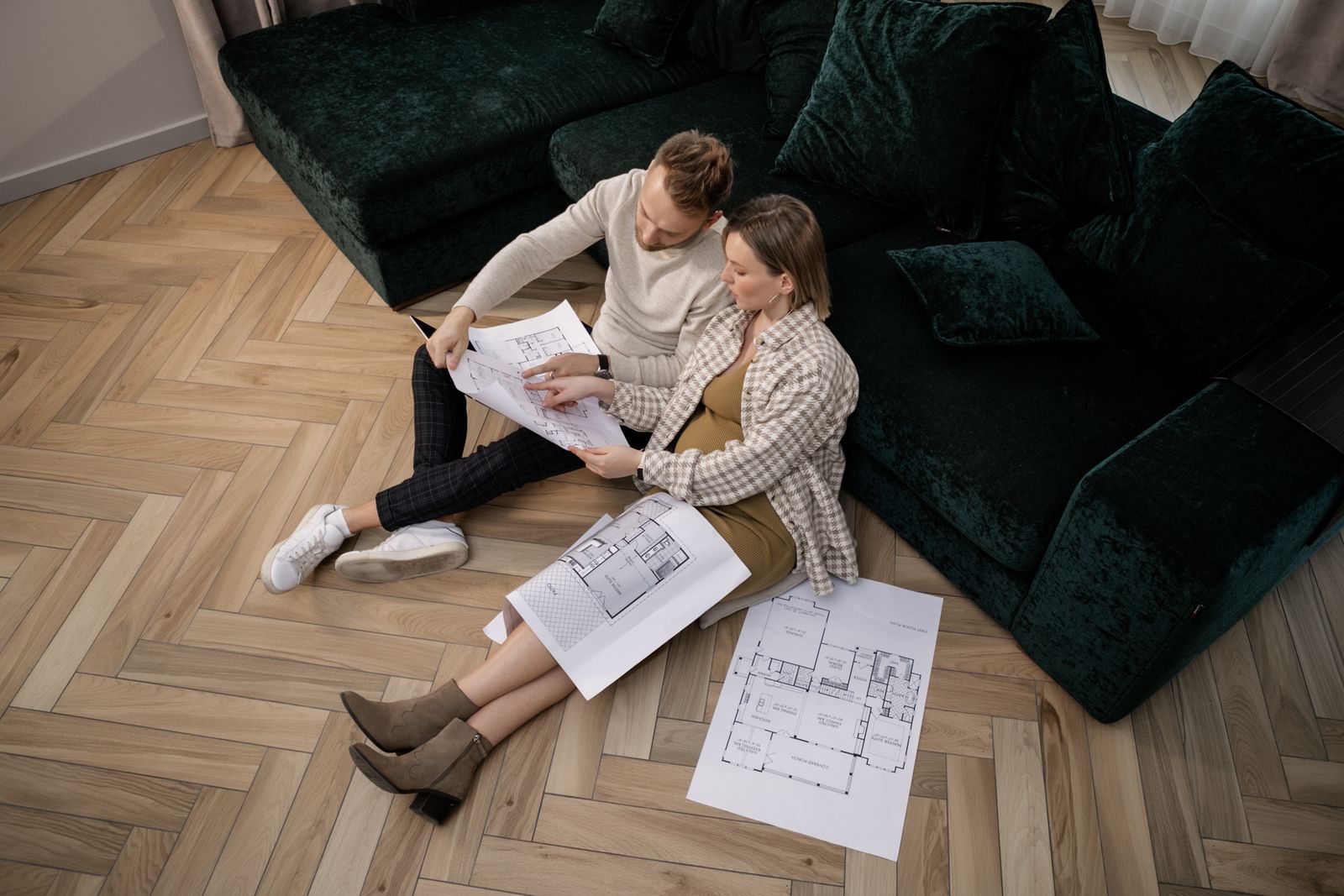 Clients reviewing home plans together before approving the design