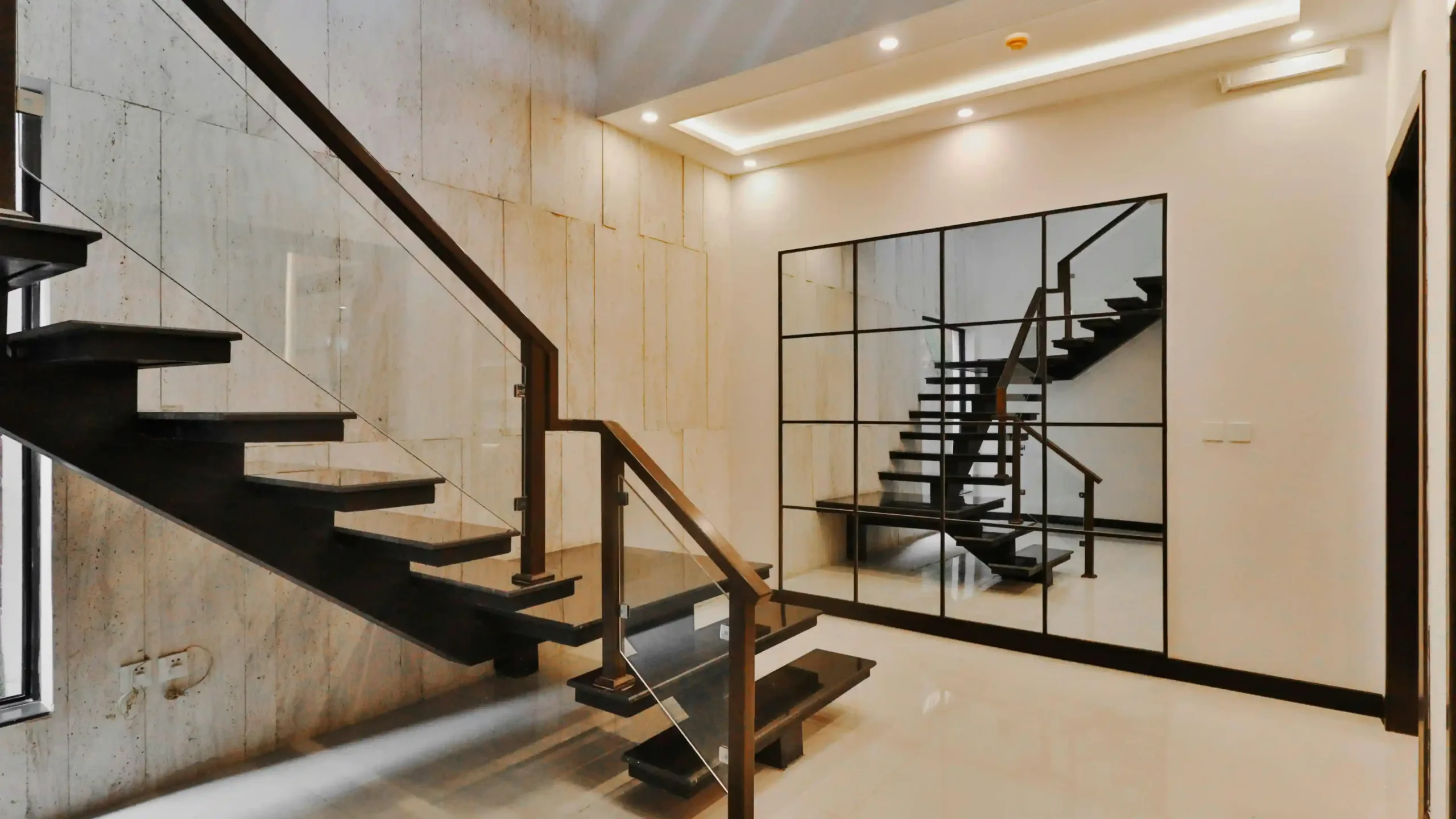 Designing a custom staircase in oak, brass and glass