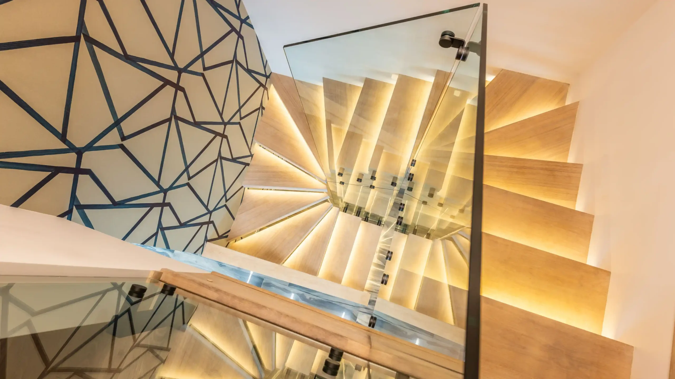 Designing a custom staircase in oak, brass and glass