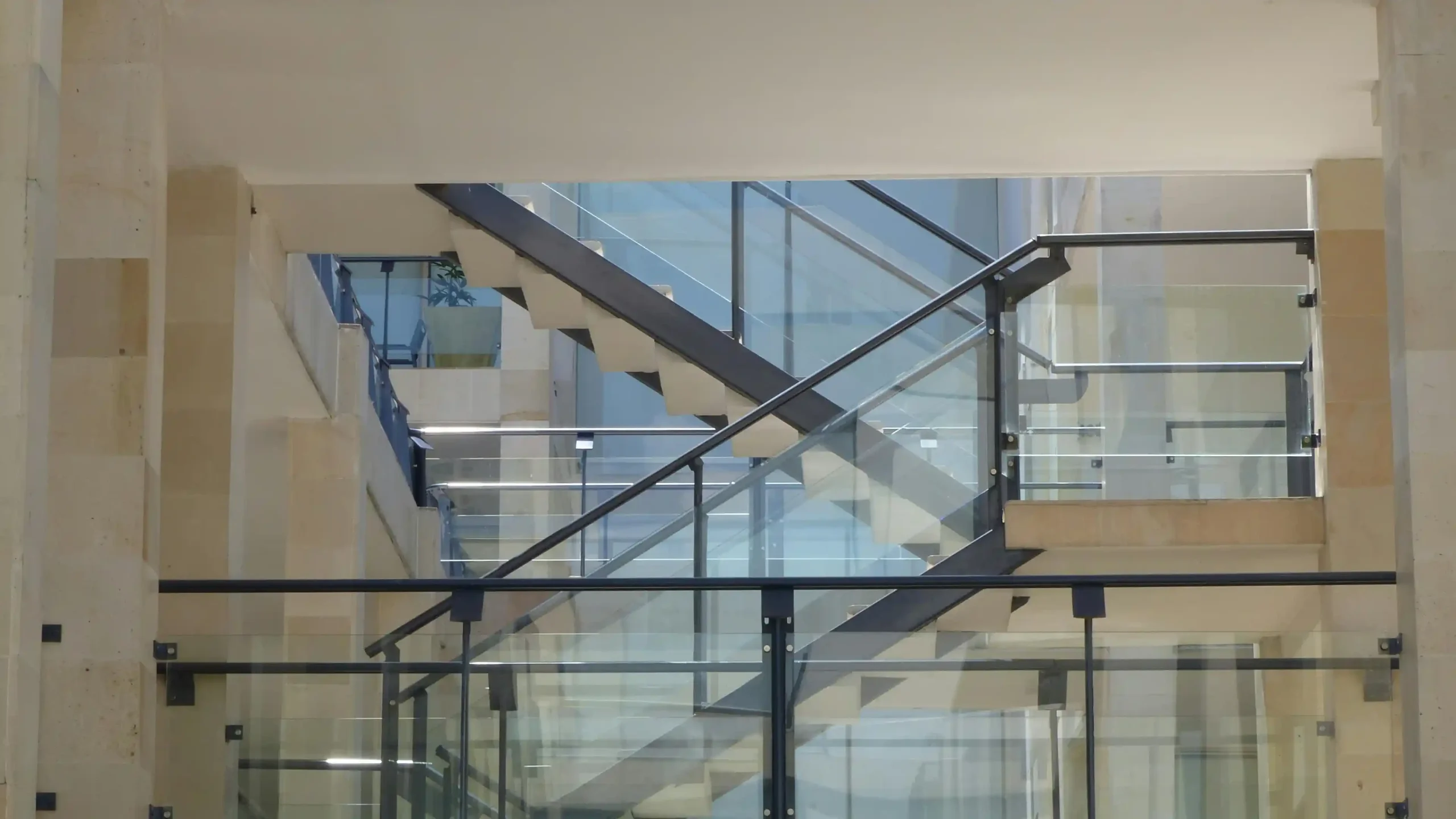 Designing a custom staircase in oak, brass and glass
