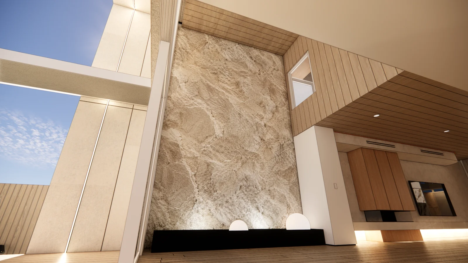Sculpted rock feature wall rising through the double height living space beside full height glazing