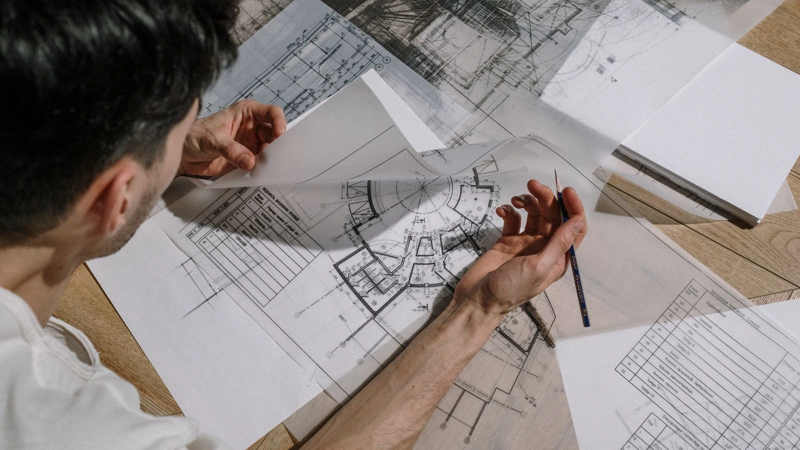 Architect preparing drawings and references for a rendering brief