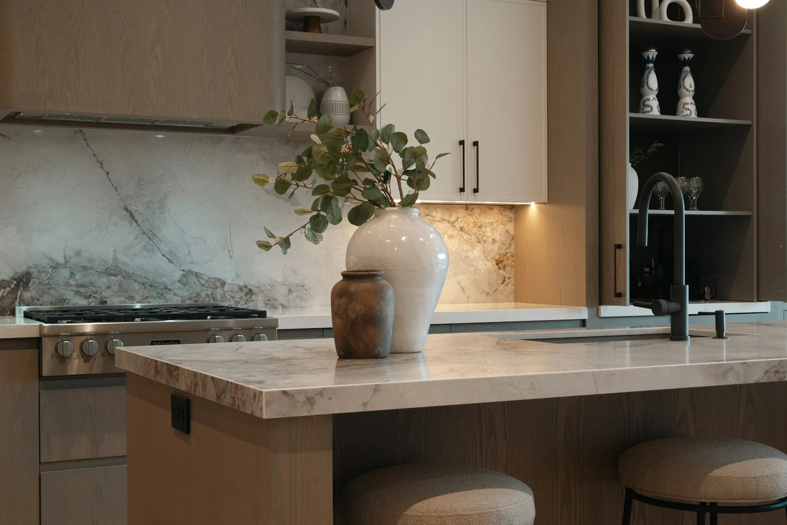 Marble splashback and benchtop detail in a renovated kitchen
