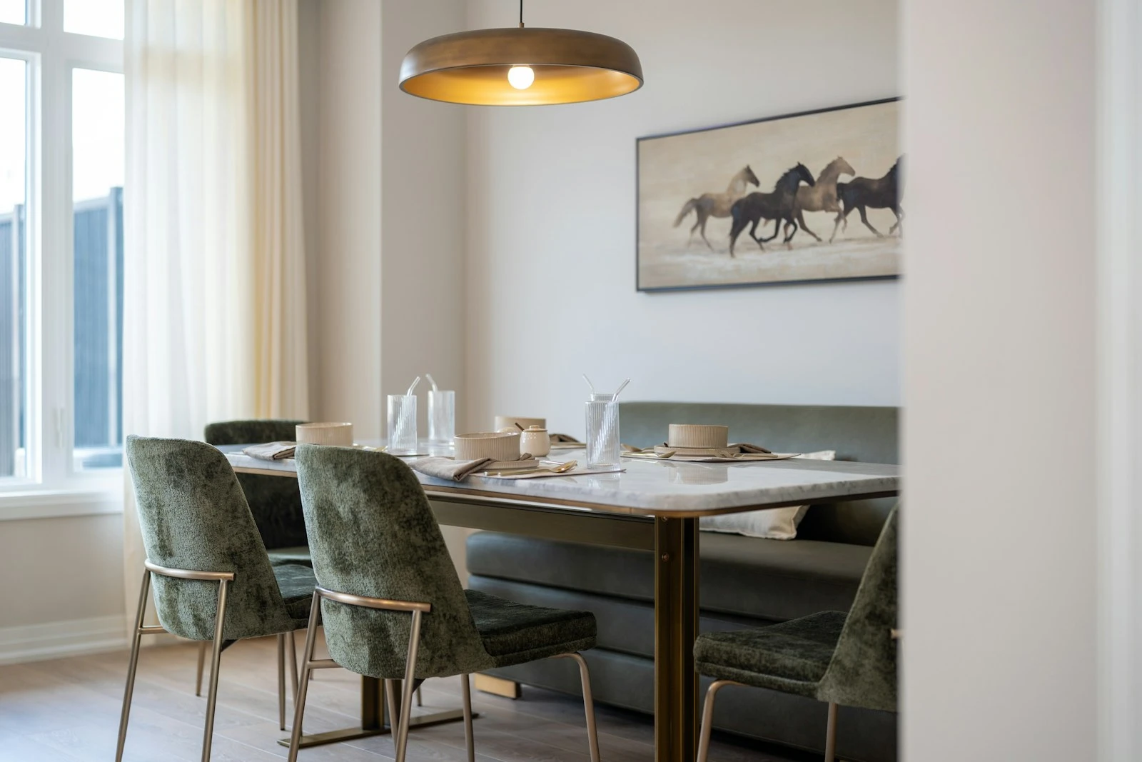 Dining space with artwork and a considered table setting