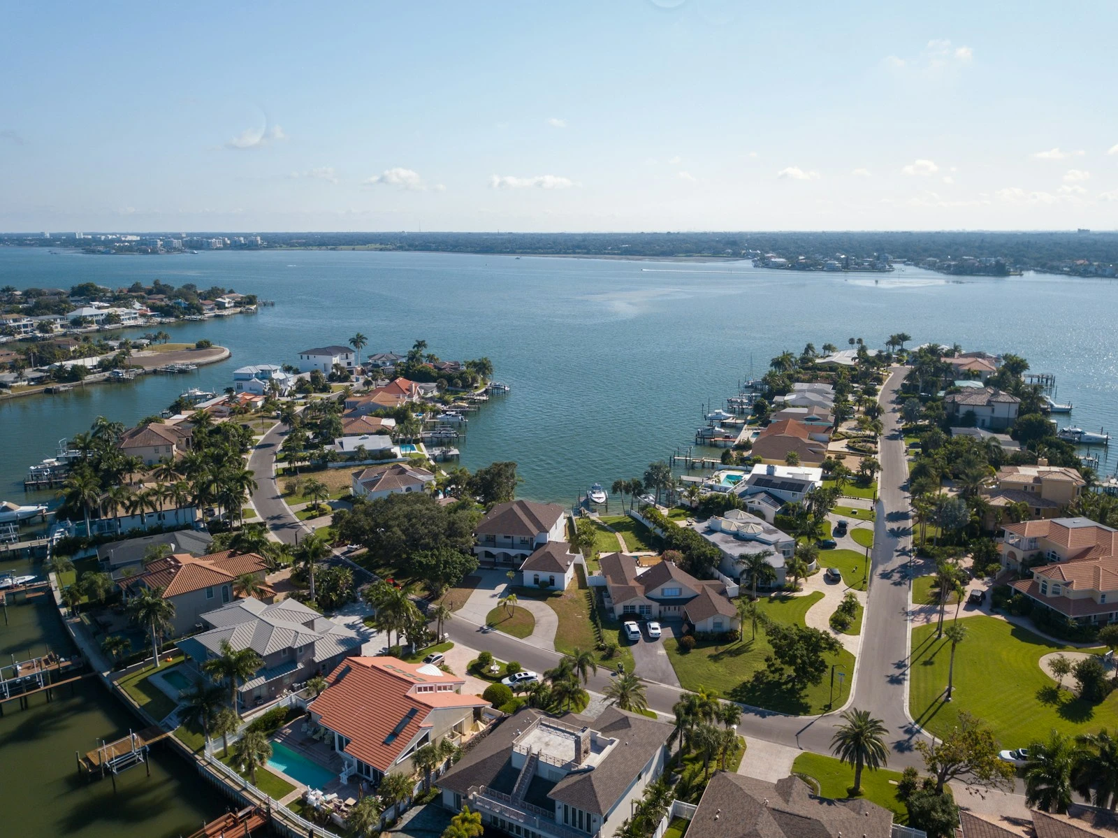Aerial view of substantial homes on a waterfront