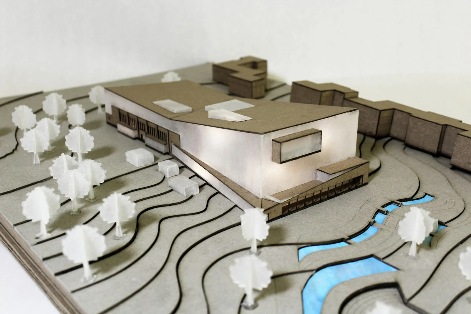 White architectural model of a house and pool