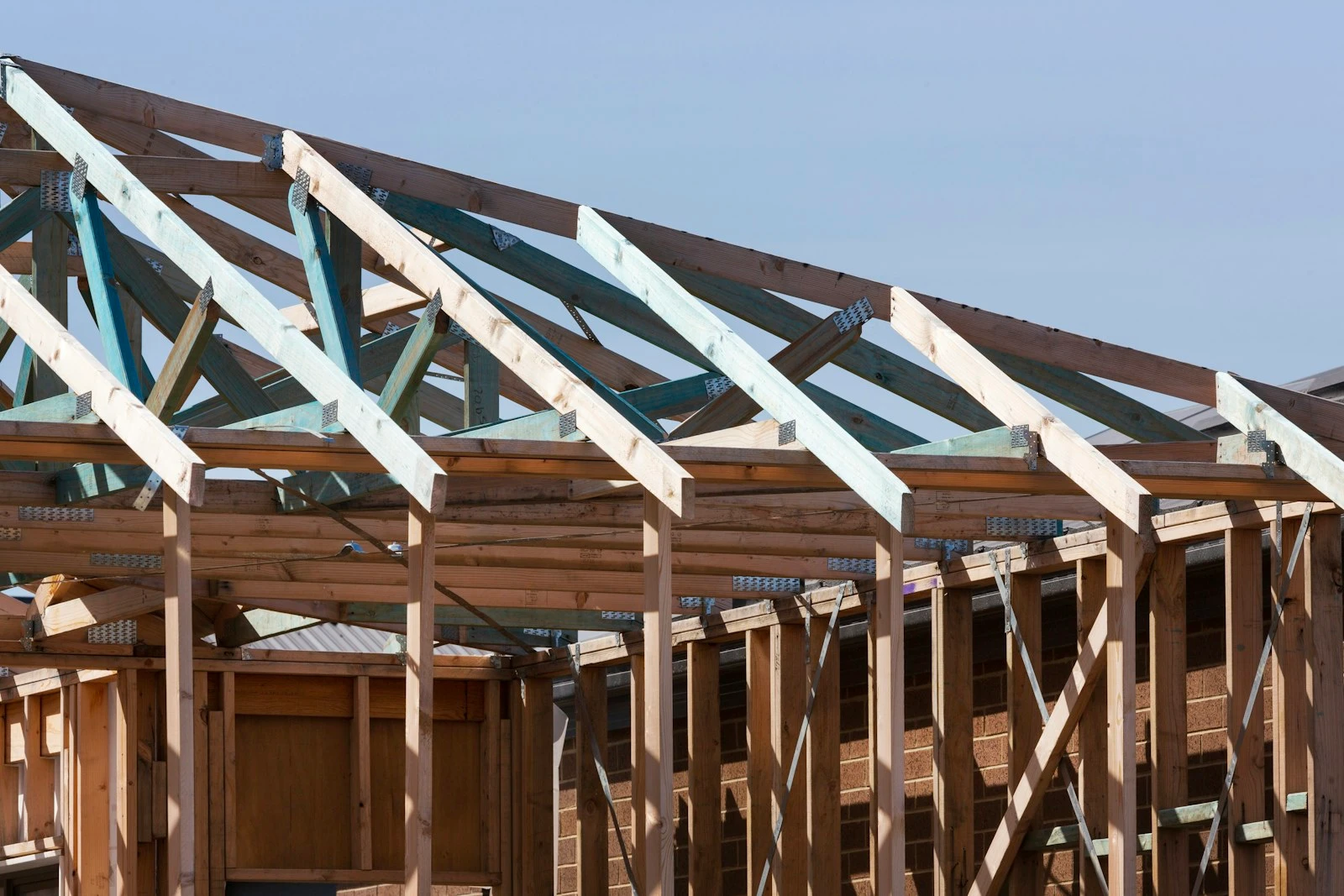 Timber roof trusses set out over a new build