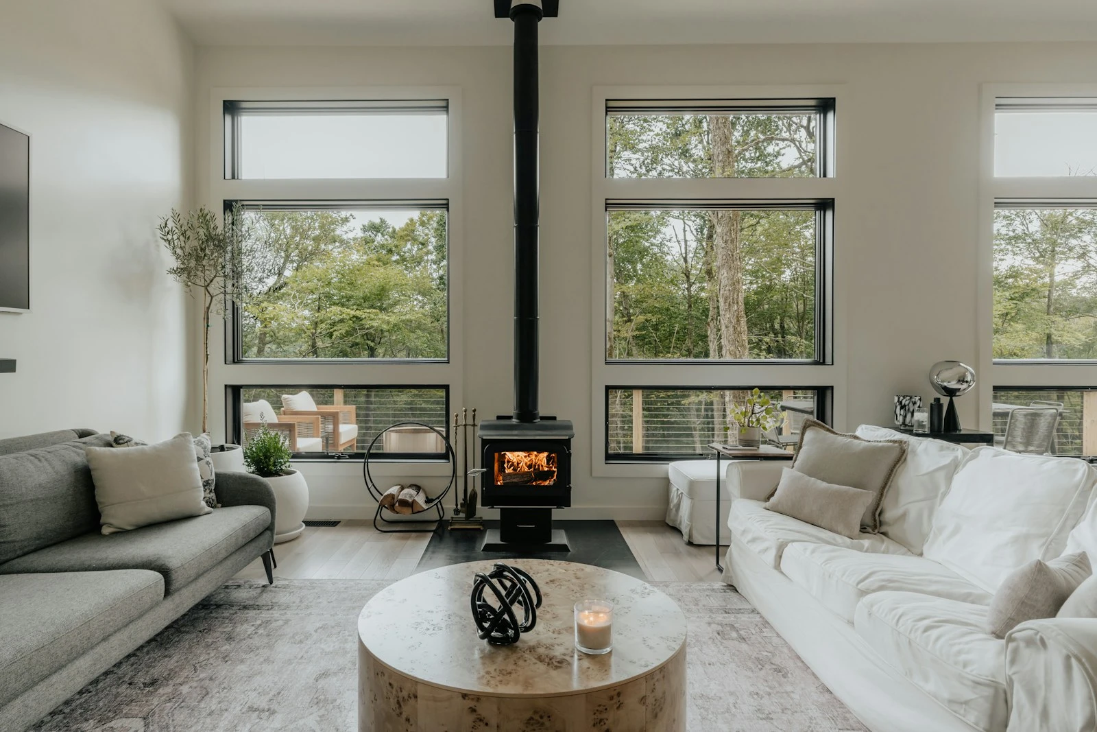 Bright living room with a fireplace and pale furnishings