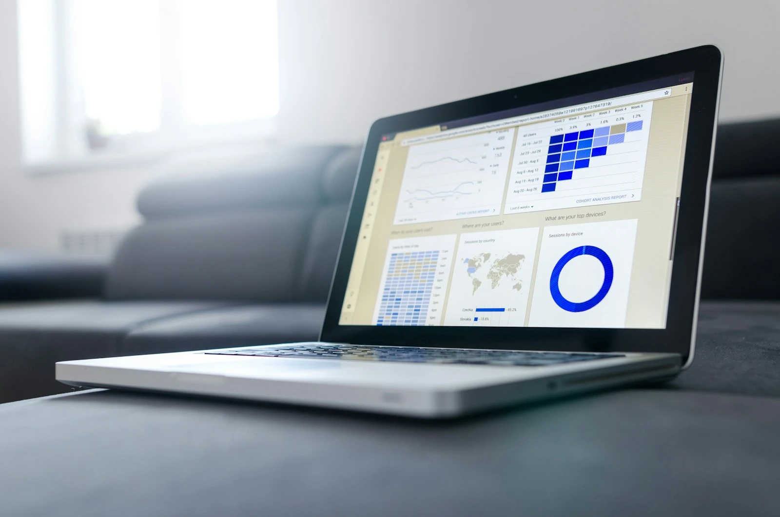 A laptop showing project tracking data