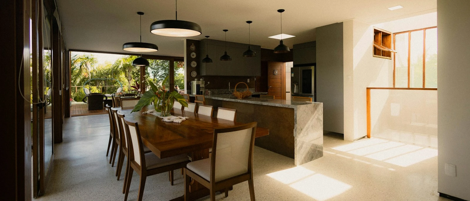 Wide view across a kitchen and dining space