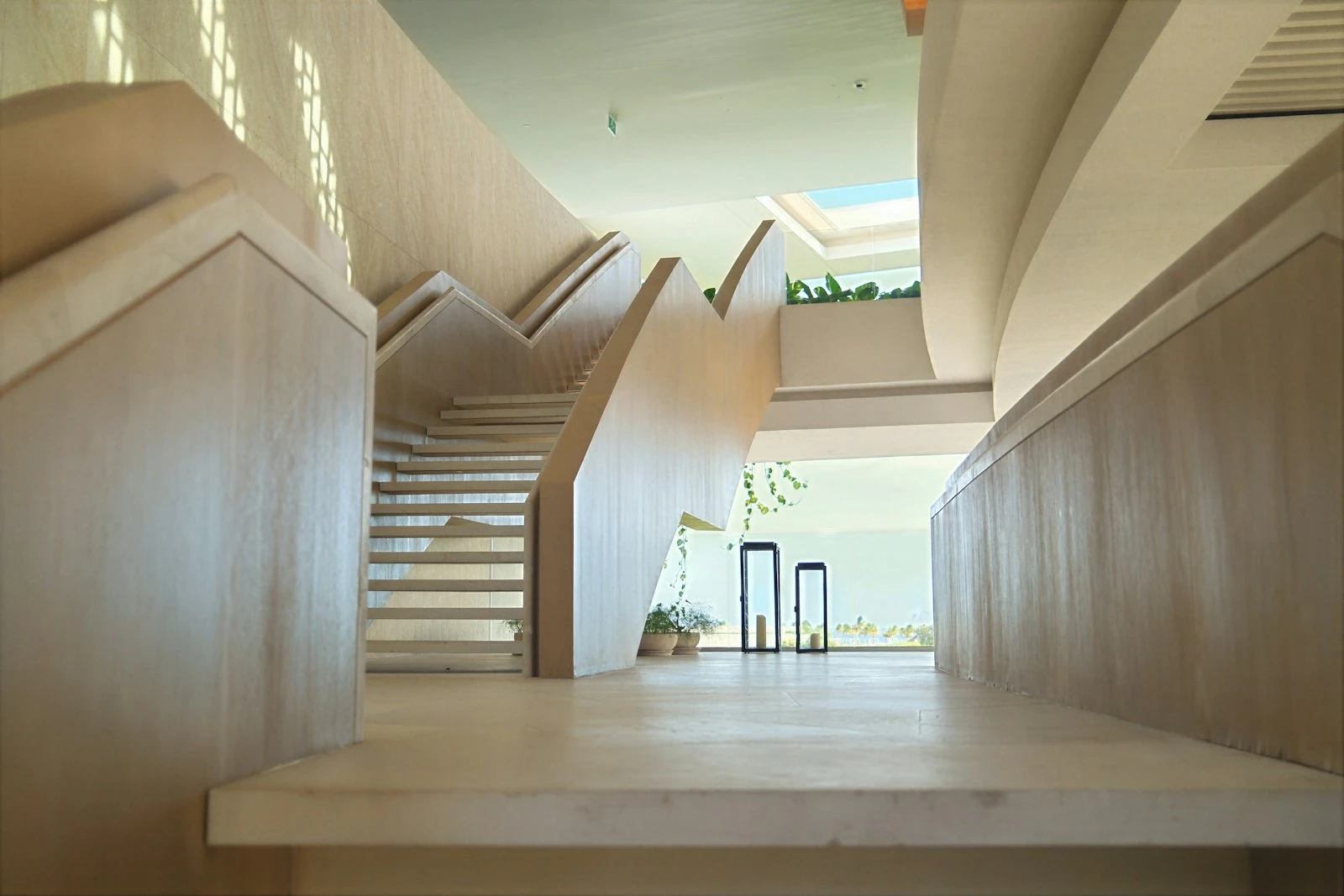 Curved sculptural staircase in a white interior