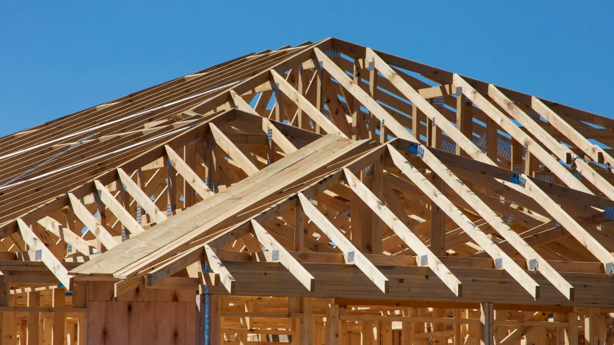 House under construction with exposed timber framing