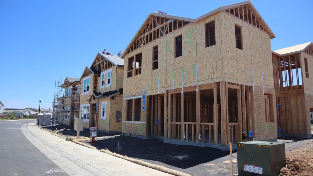 Timber house frame under construction on a residential site