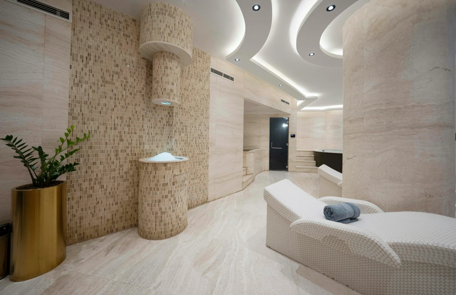 Minimal stone bathroom with a freestanding bath
